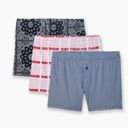 Three different printed slim fit boxers laid on grey background. One is black bandana, one is 'thank you' printed in white & red and last is blue herringbone.