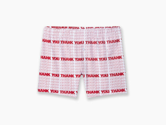 "Thank You" print repeated in white and red on slim fit boxer laid flat with grey background.