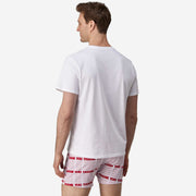 Back view of man wearing red & white printed "thank you" slim fit boxers & white t-shirt.