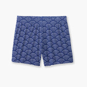 Blue lounge shorts with sunrise pattern laid flat on background.