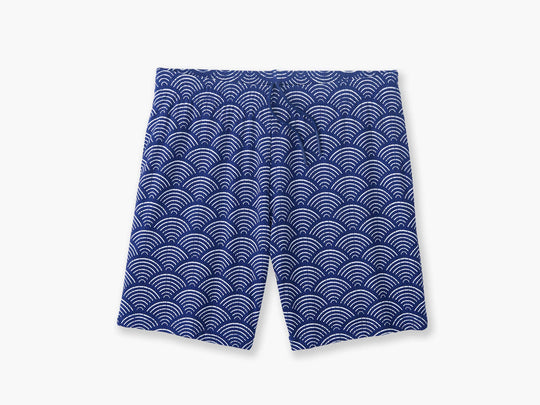 Blue lounge shorts with sunrise pattern laid flat on background.