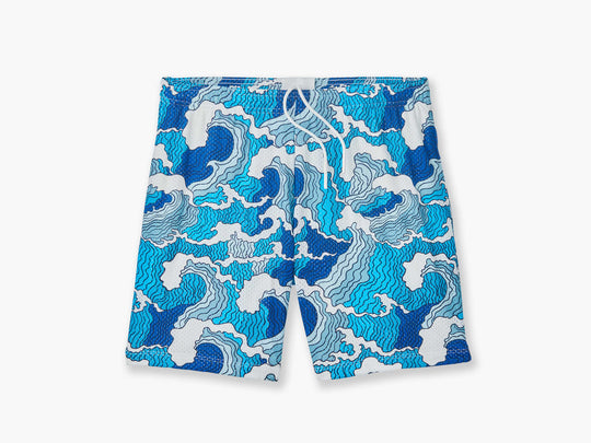 Blue & white waves print on lounge short placed flat on grey background. 