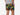 Back view of man wearing green lounge shorts with tiger and snake print with his hand in his pocket.